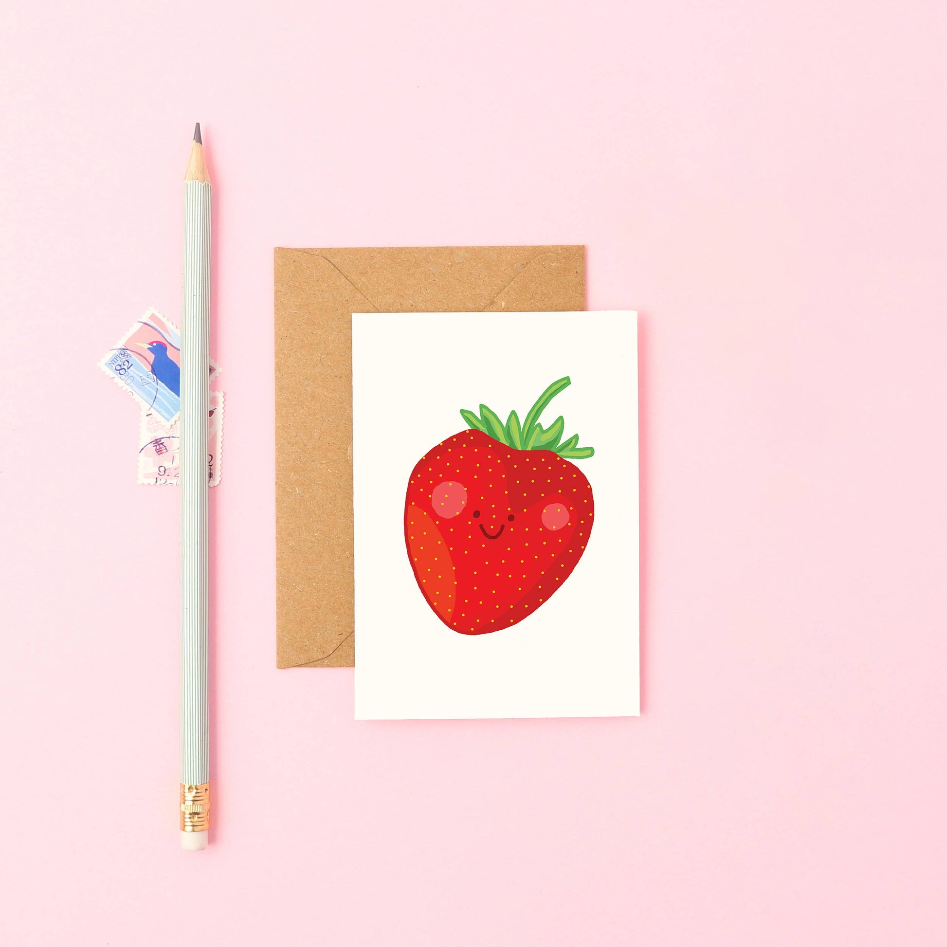 Hand-drawn mini strawberry greeting card—smiling fruit design, A7 size, sustainable UK card with Kraft envelope.