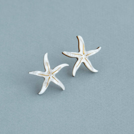 Pearly white starfish stud earrings with gold detailing