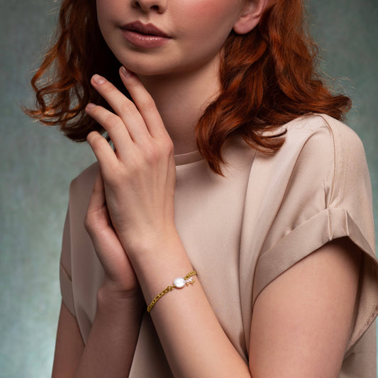 Close-up of freshwater pearl and seed pearls on gold plated bracelet