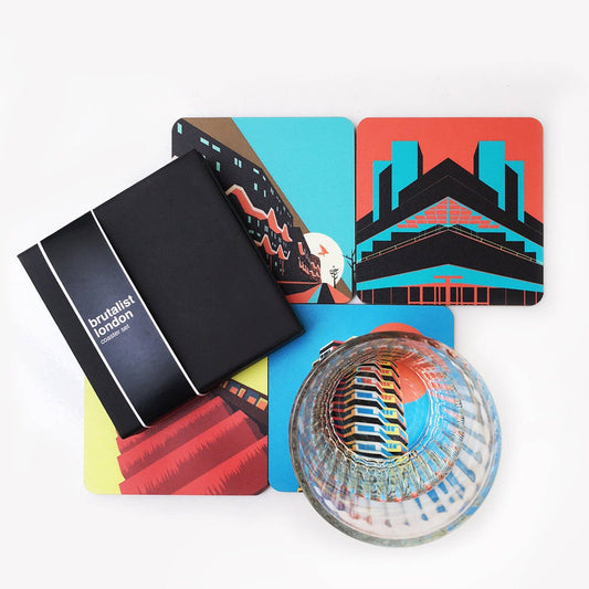 Brutalist London Coaster Set. Set of 4 coasters featuring London Landmarks. Prints of Barbican, Brixton, Croydon and National Theatre. These coasters feature some of the most iconic Brutalist structures of London. One Croydon, the Barbican Tower, Southwyck House, Brixton and the National Theatre in South Bank.

Specs: The coasters measure 10 x 10cm, about 5mm thick. Cork backed hardboard, and matte laminated finish.

They come in a smart, minimal black match-box style packaging. 