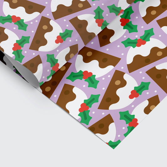 Christmas pudding holiday gift wrap sheet by Studio Boketto, bold illustration on snowy lilac background, sustainable certified paper, UK made