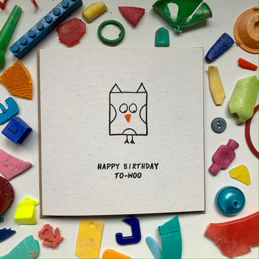 Children's birthday card with owl illustration and colourful plastic pieces around it. By Washed Up Cards.