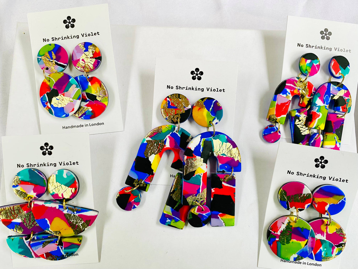 Detail shot of handcrafted polymer clay earrings, silver-plated findings.