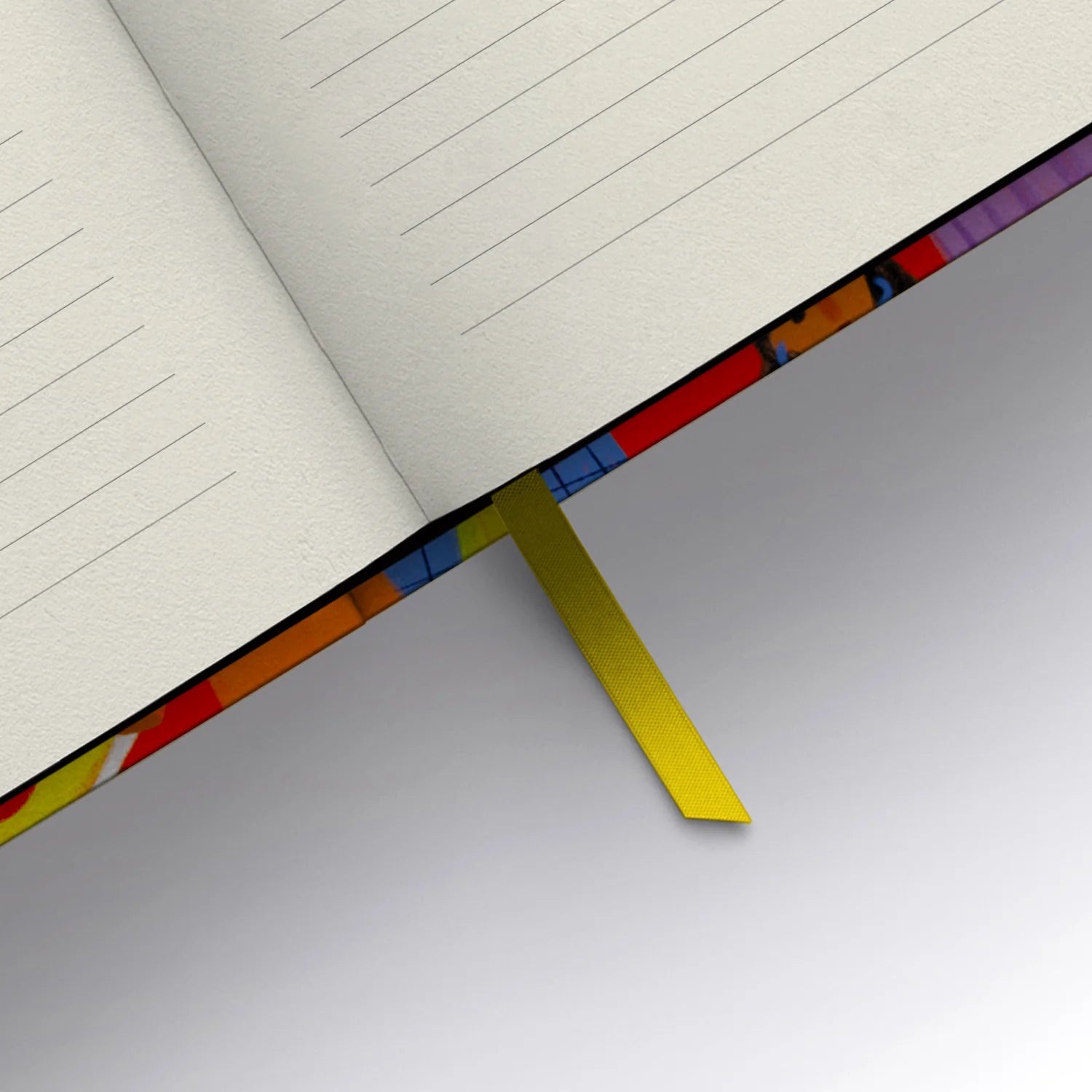 A playful tone meets practical design in this Carolyn Suzuki Notebook: a case bound, lay-flat binding notebook with 144 lined pages, luxurious 120gsm off white paper, a laminated cover, and a matching ribbon bookmark.