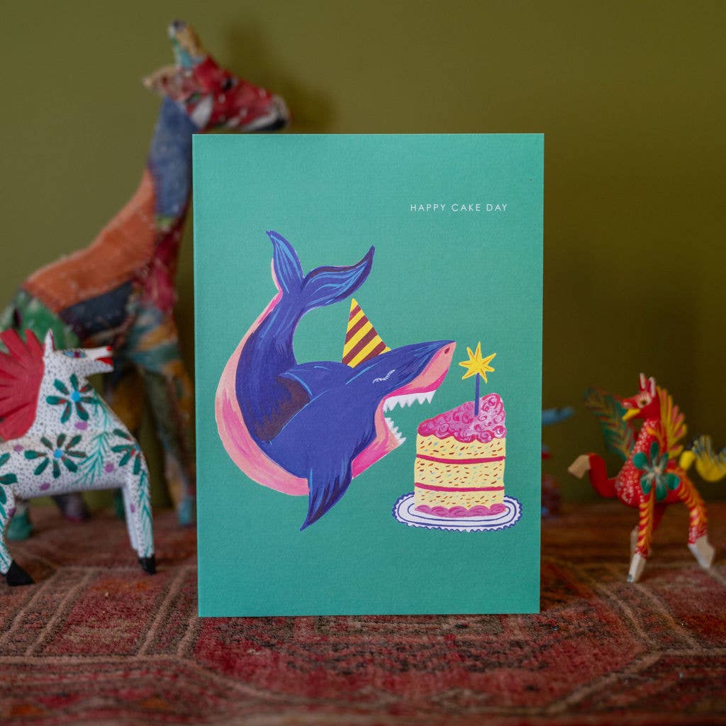 Hand-illustrated shark and rainbow cake birthday card details