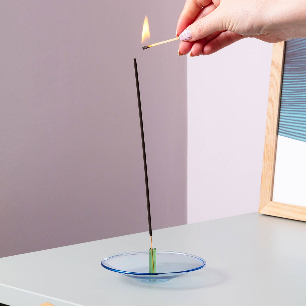Float glass incense holder in living room setting