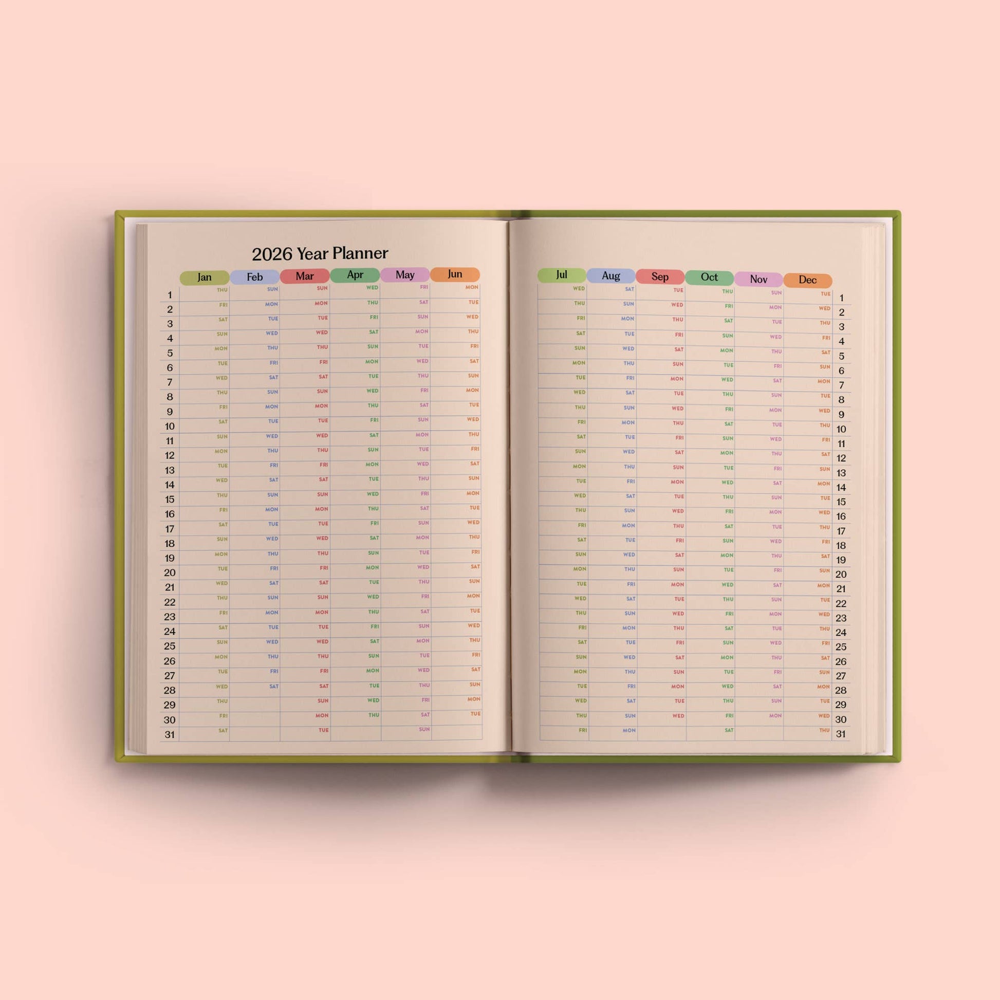 2026 year planner open to a pink background. 2026 Weekly Planner by Good Tuesday—cobalt blue hardback, starburst pattern, A5, recycled, UK made.