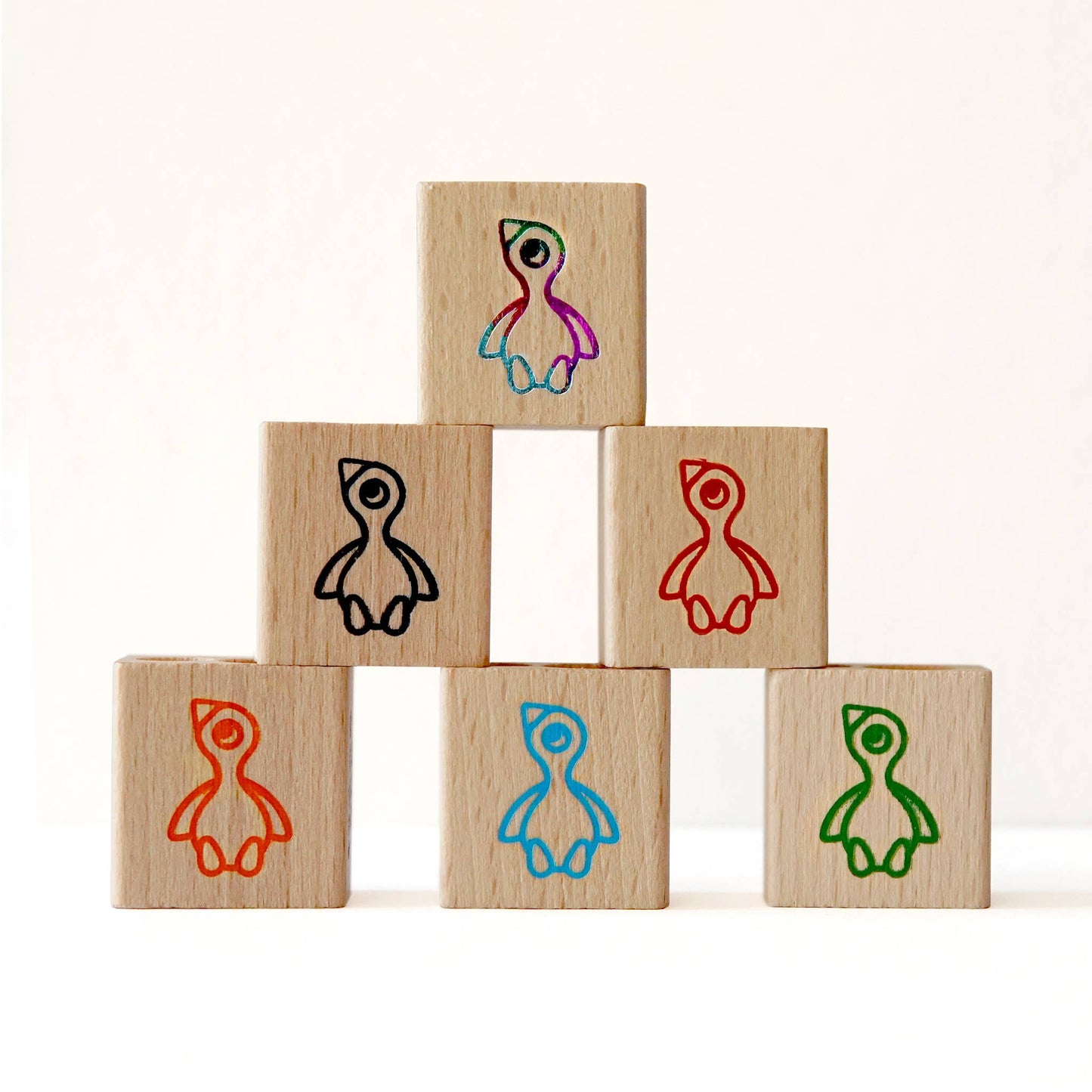 Hand-printed wooden sharpener in red foil