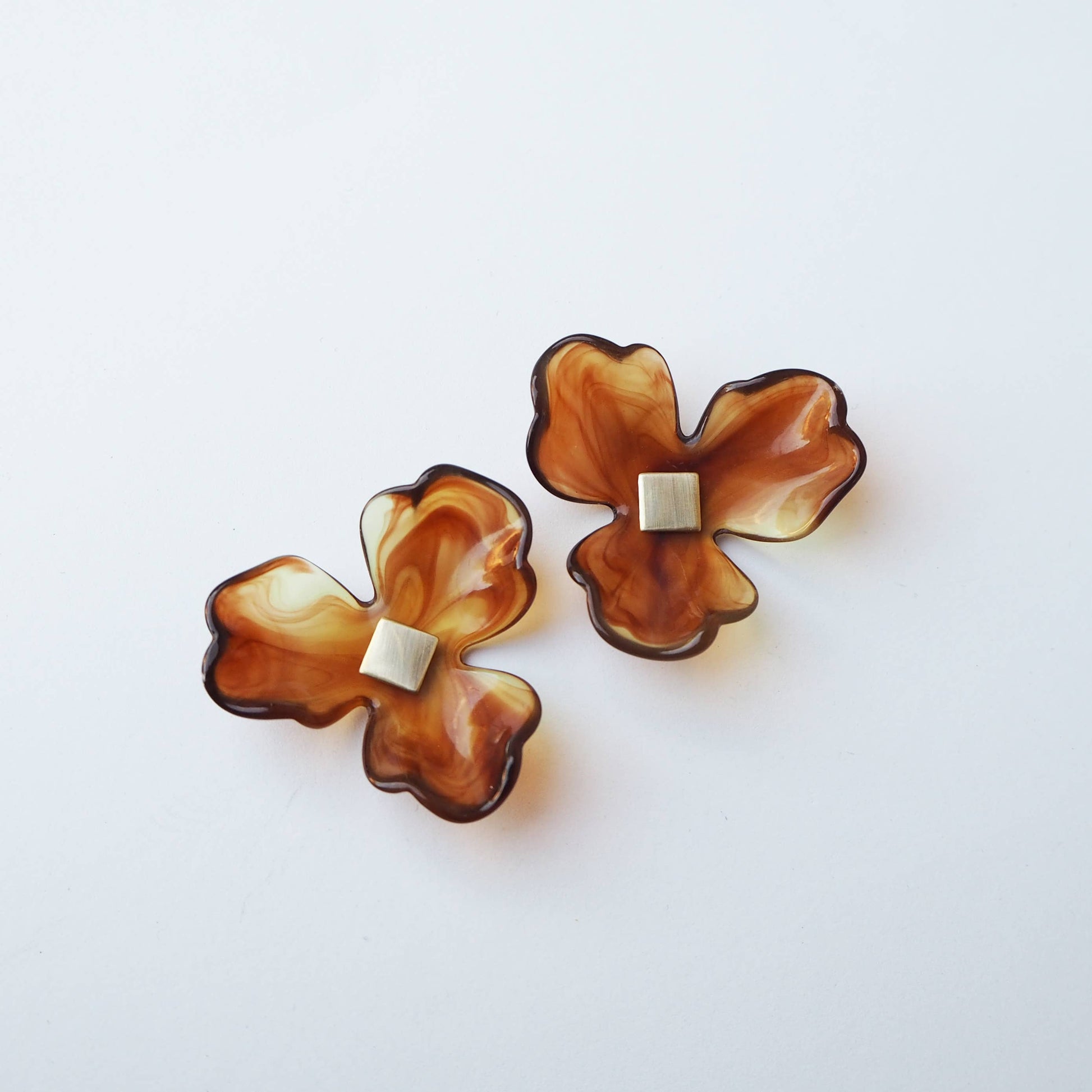 Ochre flower statement earrings on model