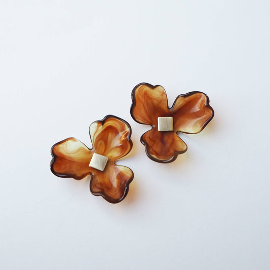 Ochre flower statement earrings on model