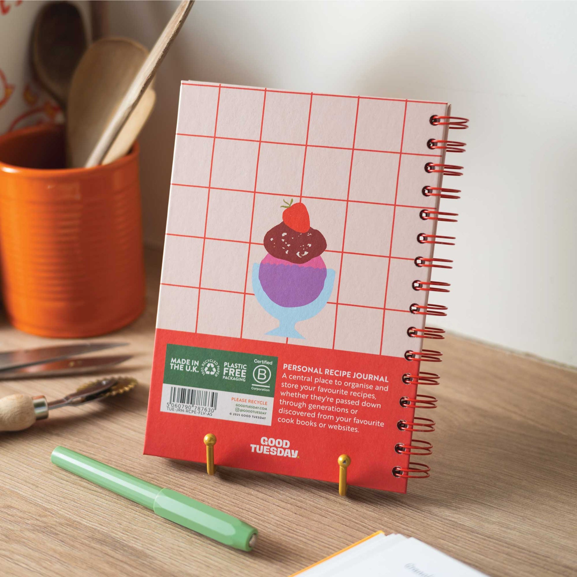 Flavours A5 Recipe Journal next to cooking ingredients, highlighting its use