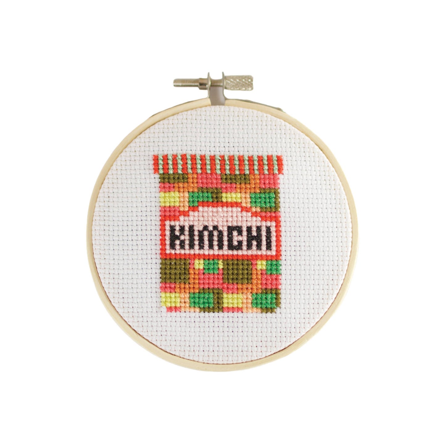 Side view of the Kimchi Mini Cross Stitch Kit's plastic-free, recyclable striped box with branding visible.