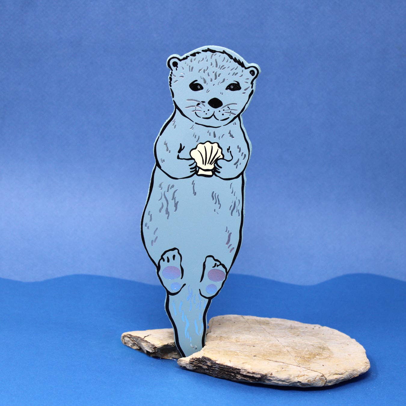 Handmade leather otter bookmark, embossed with Otterly Relaxed, British made by Ark Colour Design.