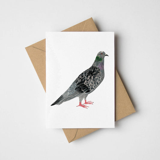 Mini A7 greeting card with a cute pigeon illustration, shown with a Kraft envelope, highlighting its compact size and UK craftsmanship.