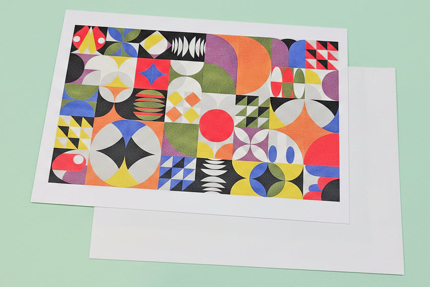 Colourful geometric patterned card on a light green background