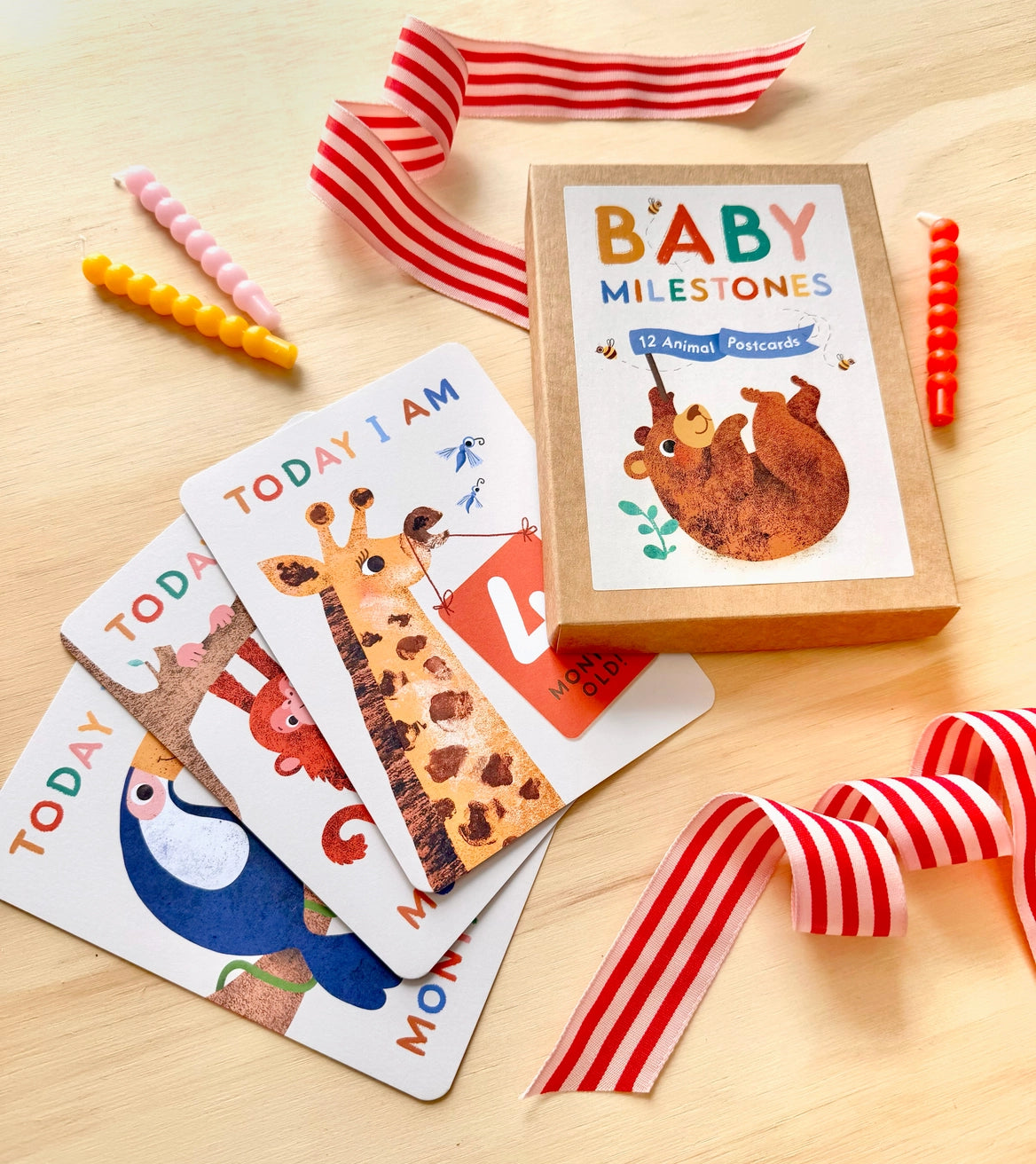 Sustainably sourced animal baby milestone cards in a cardboard box