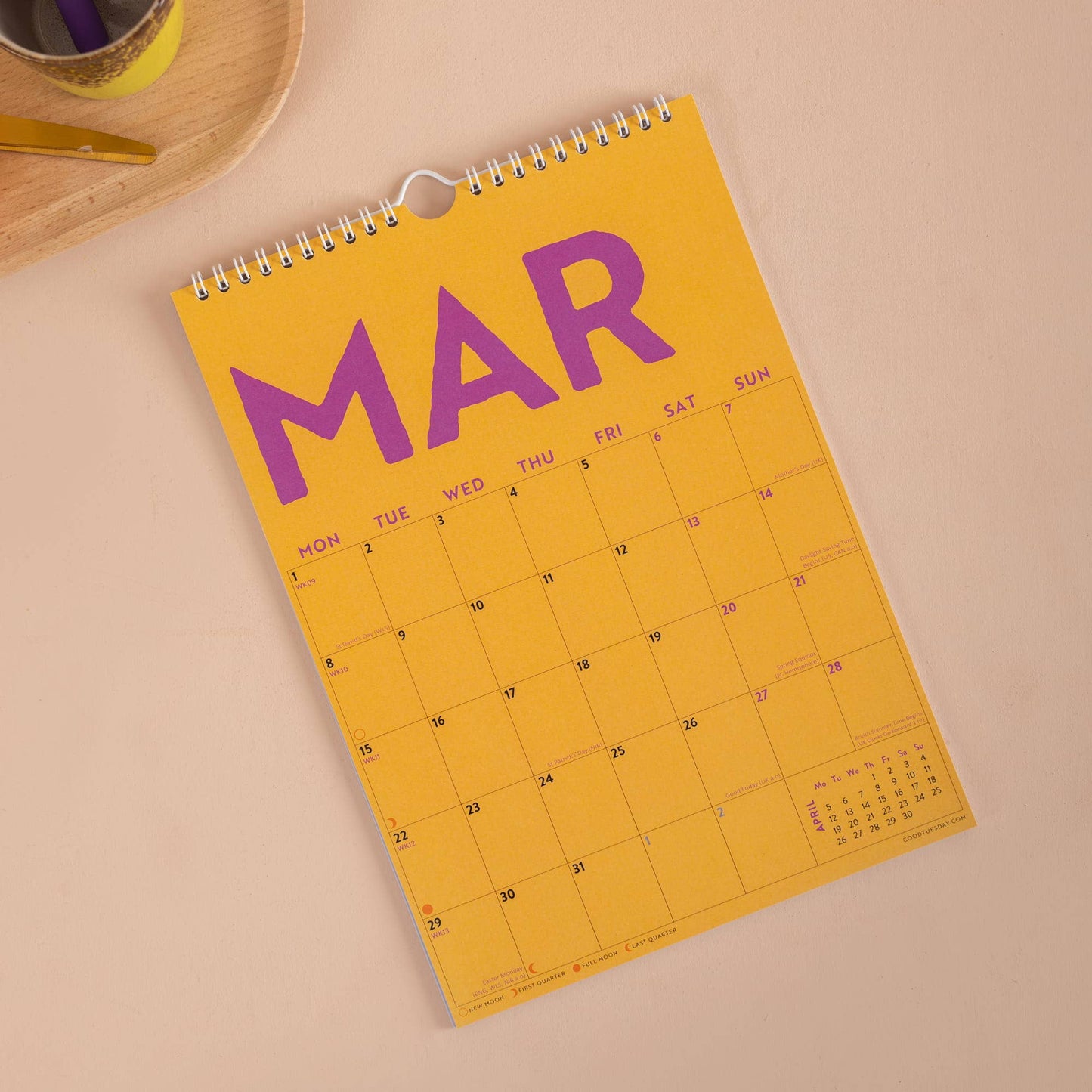 Close up of recycled paper texture and white wire binding on 2027 calendar