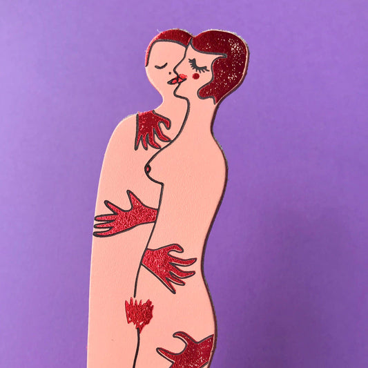 Unique leather bookmark with couple embracing and 'Book Lovers' inscription.