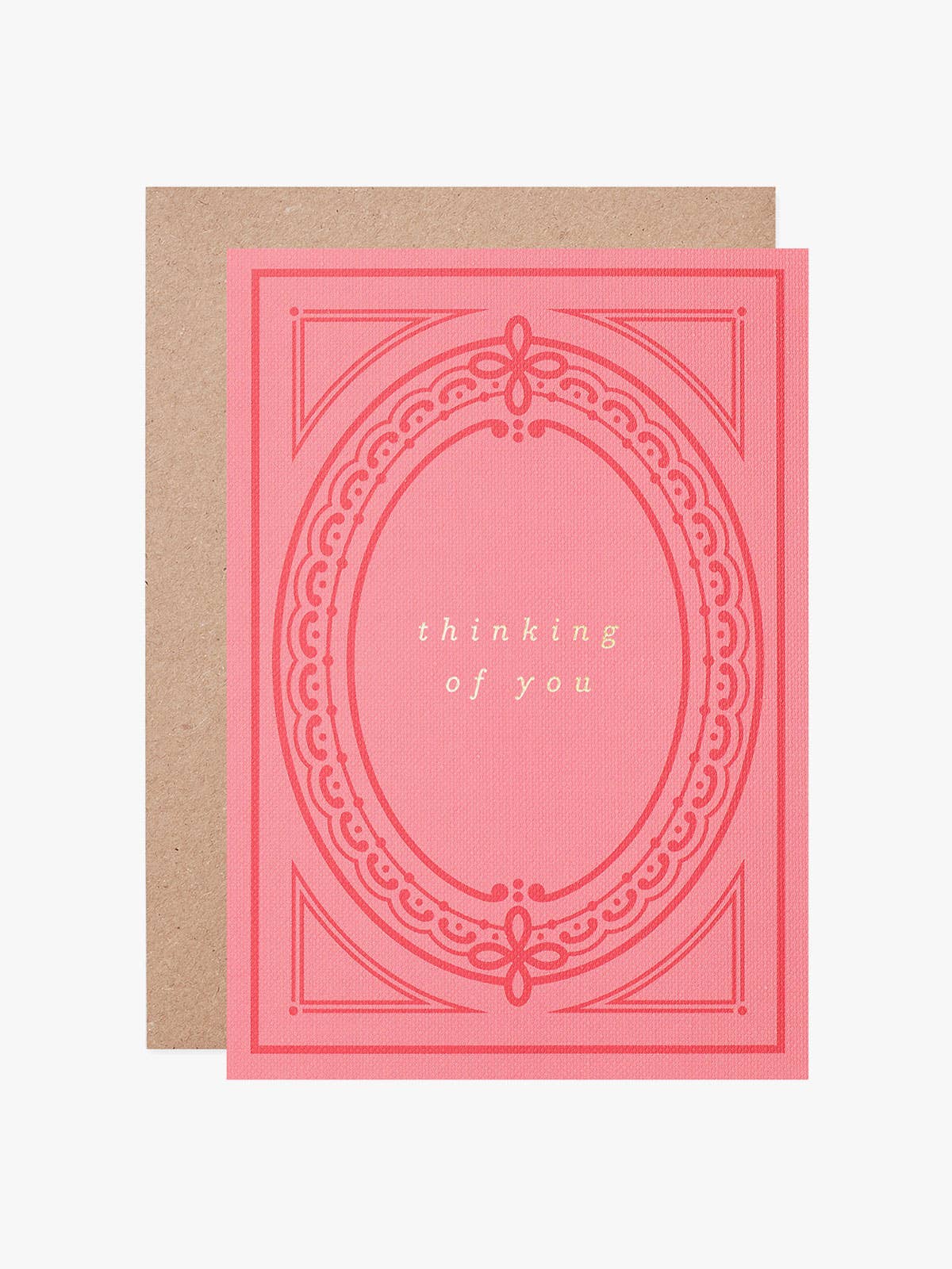 Thinking of You eco-friendly greeting card with hot foil text on pink buckram-textured card, inspired by a vintage book cover, with a recycled kraft envelope.