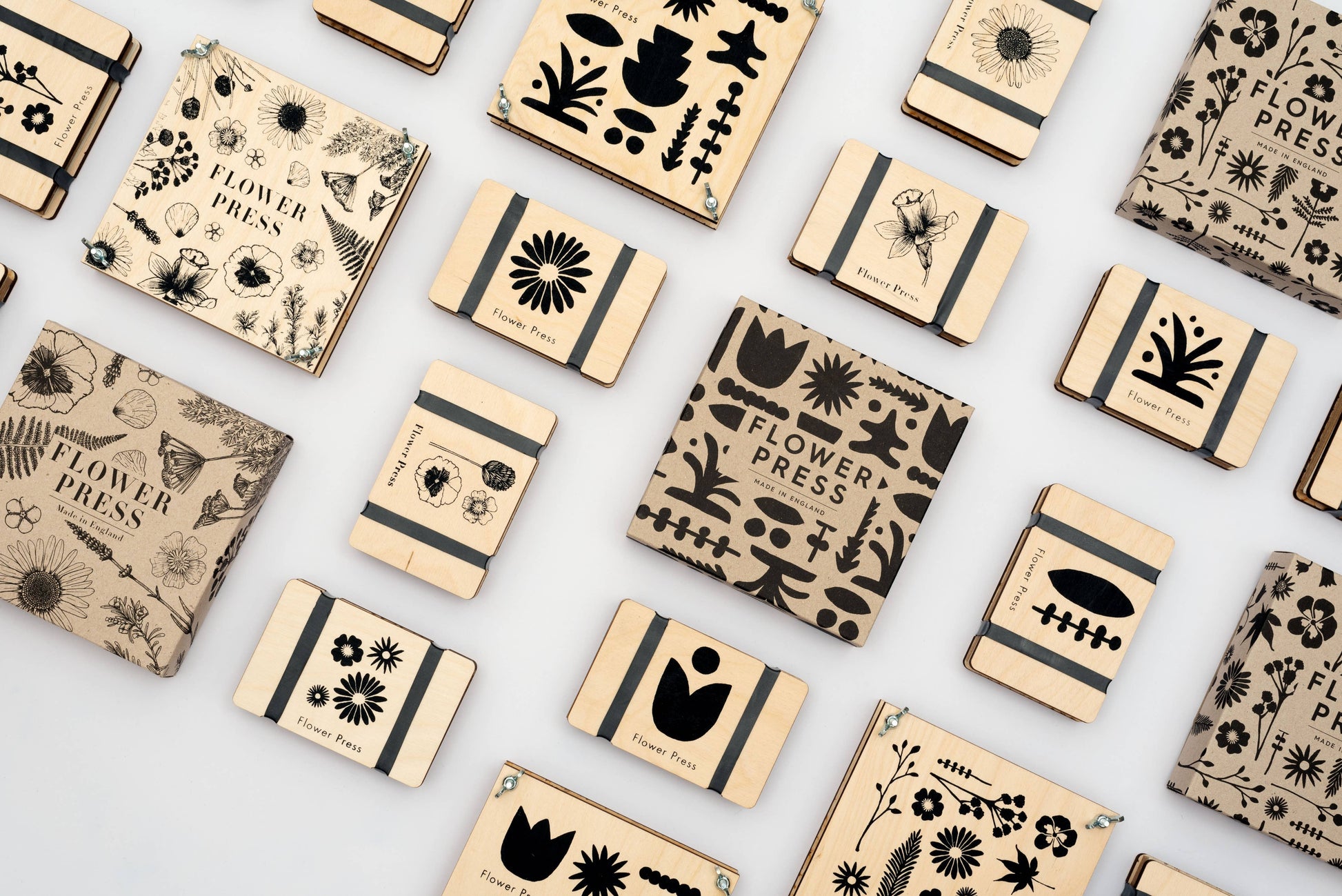 Pocket Flower Press made from sustainable maple veneered wood with corrugated card and sugar paper sheets, silicone rubber bands; pocket-sized and handmade in England.