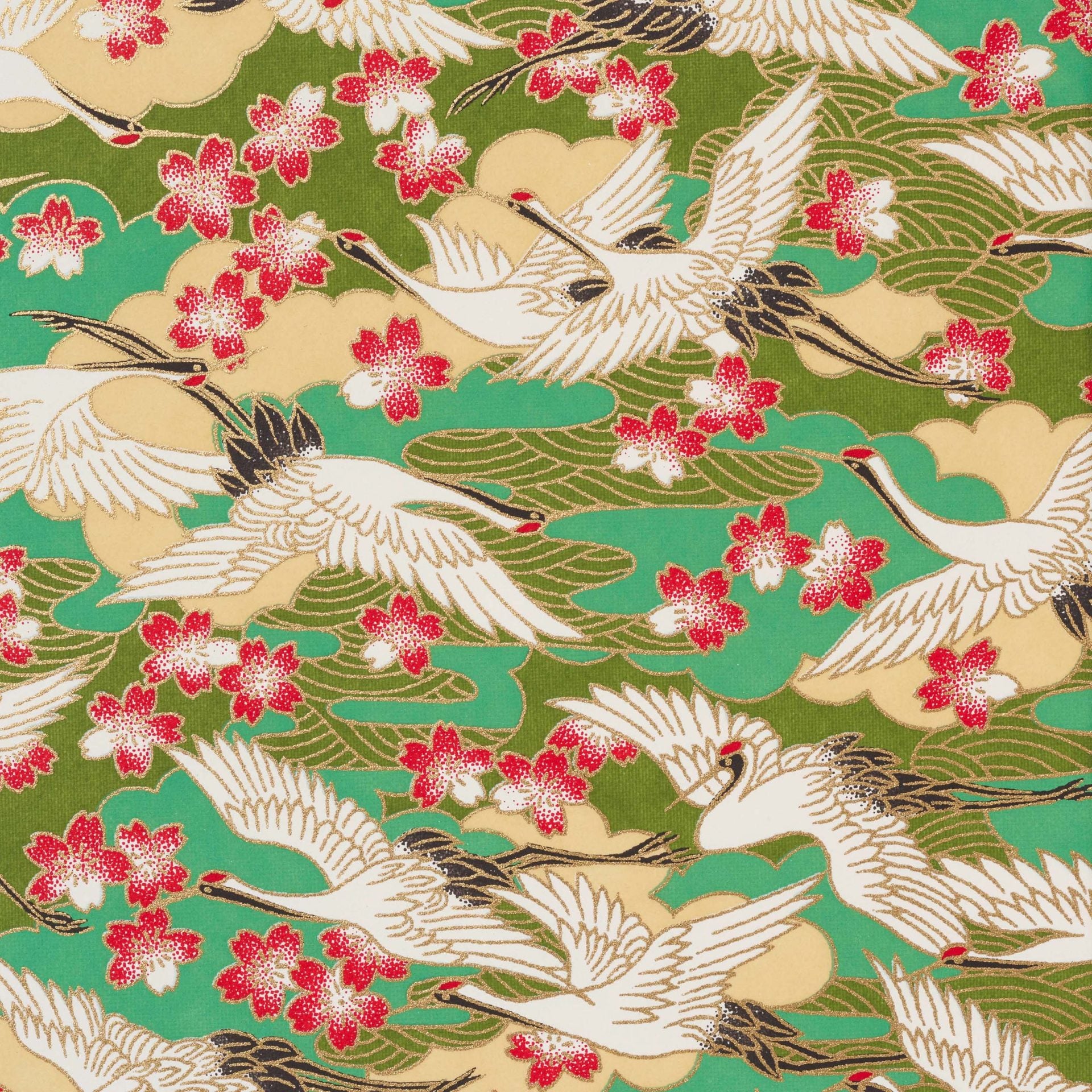 Close up of the beautiful screen printed paper of white cranes, against a green background with red flowers. screen printed paper selected from an archive of designs in Kyoto Japan