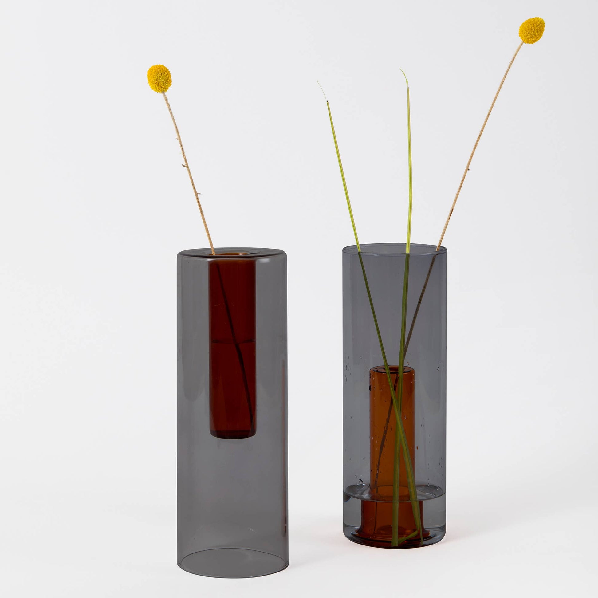 Reversible glass vase used as a single stem bud vase