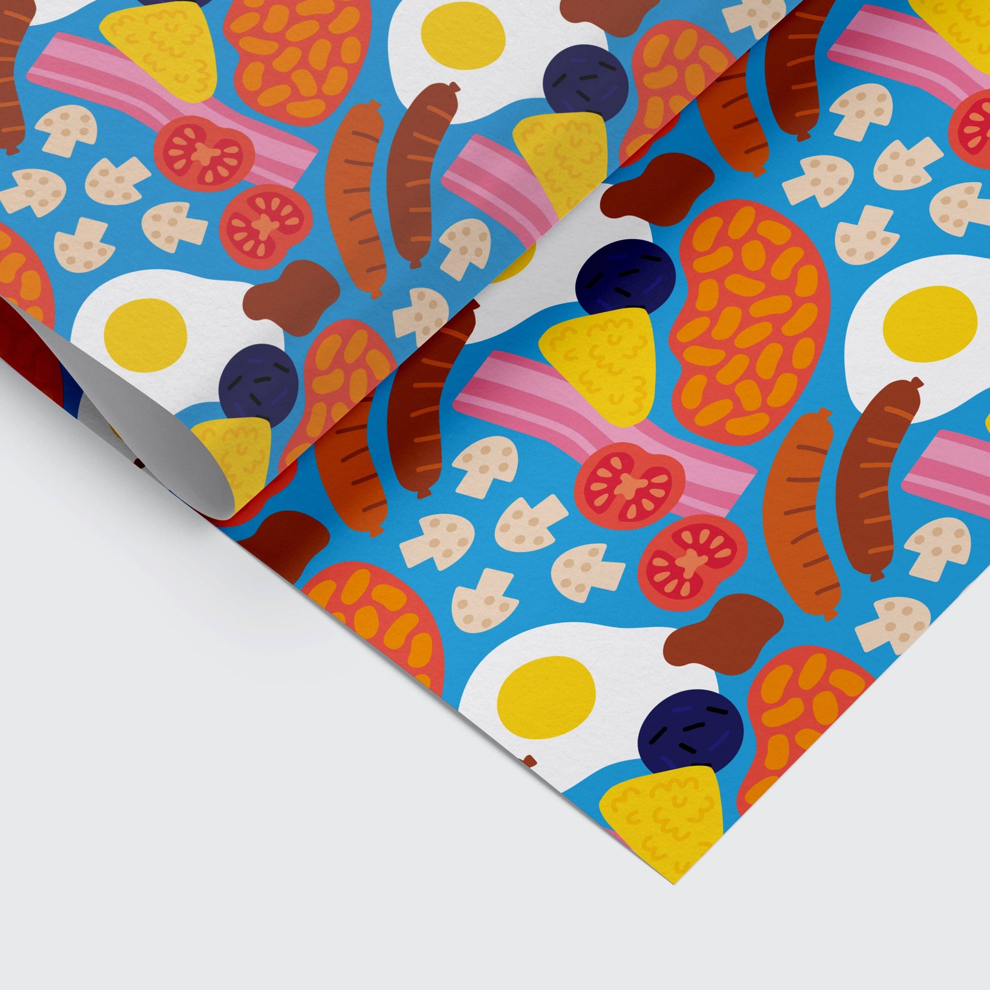 Full English breakfast themed gift wrap sheet on bright blue background