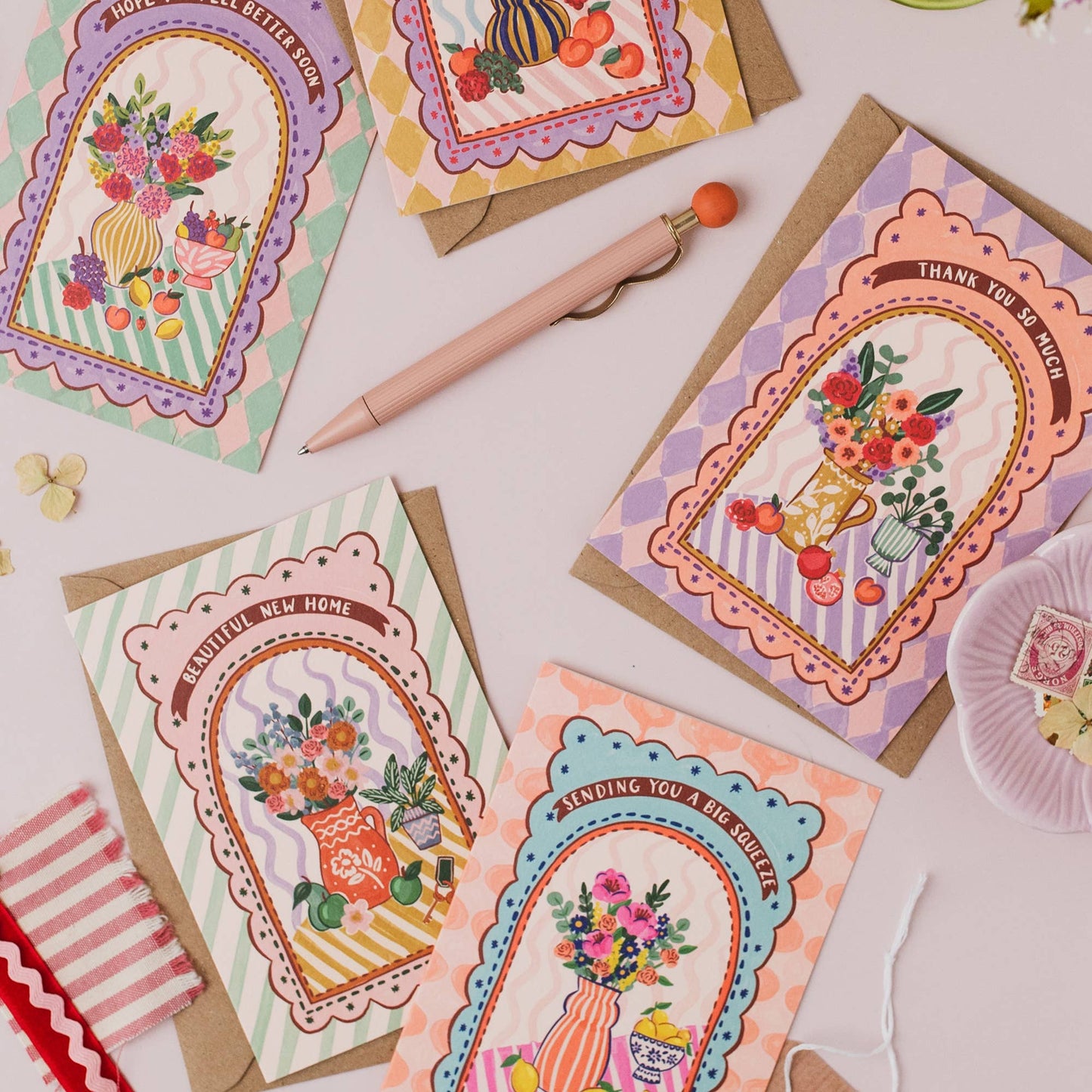 Collection of 'Harlequin' range cards, highlighting the maximalist fruit and floral theme