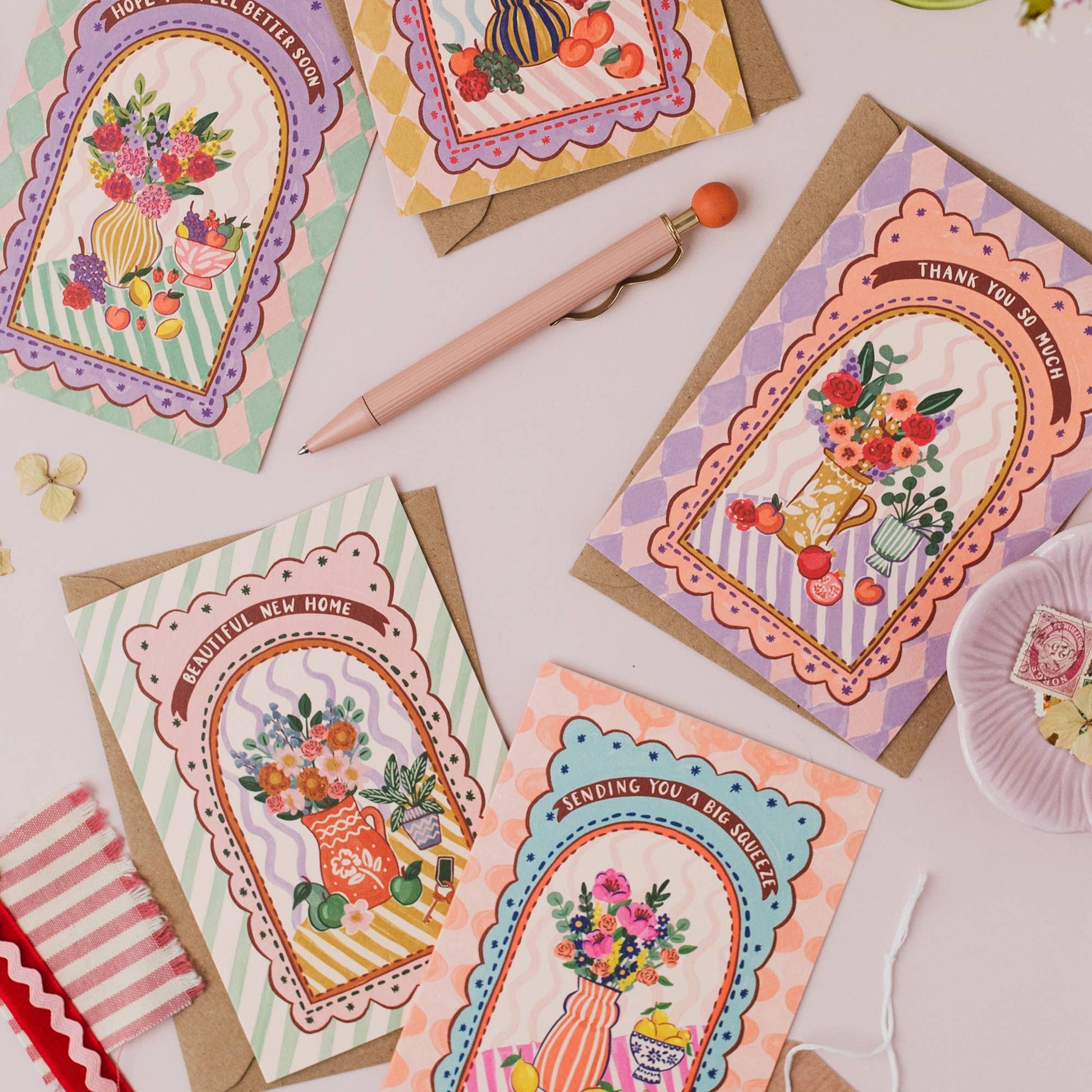 Collection of 'Harlequin' range cards, highlighting the maximalist fruit and floral theme