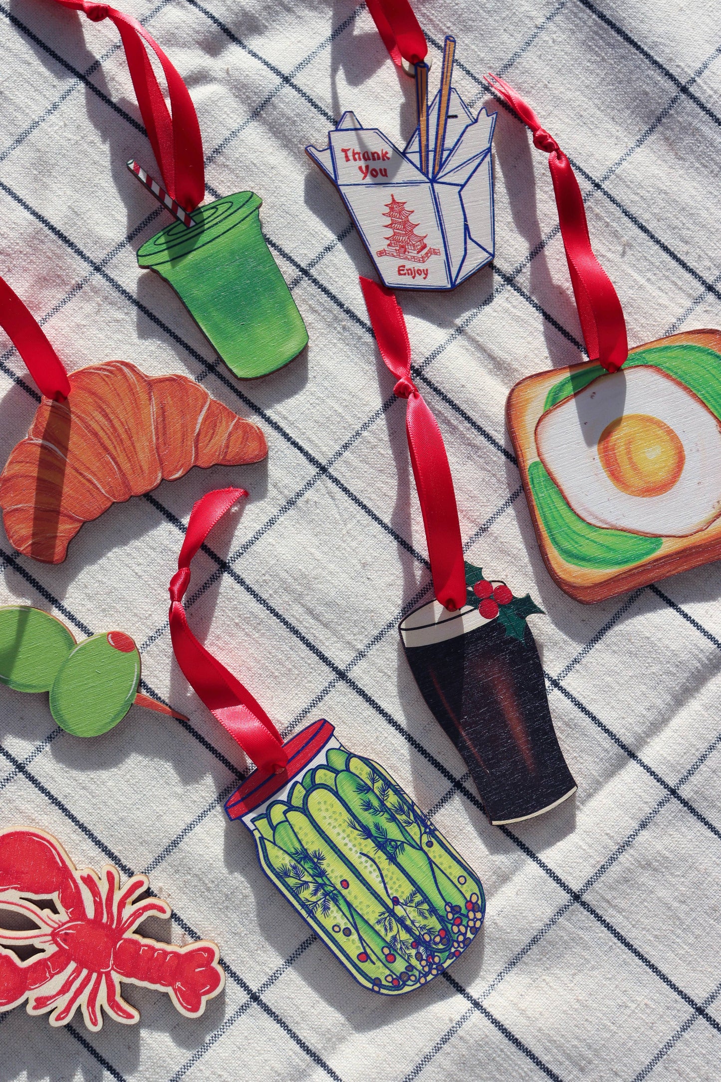 Close-up of Pickle Jar Christmas Ornament with red ribbon