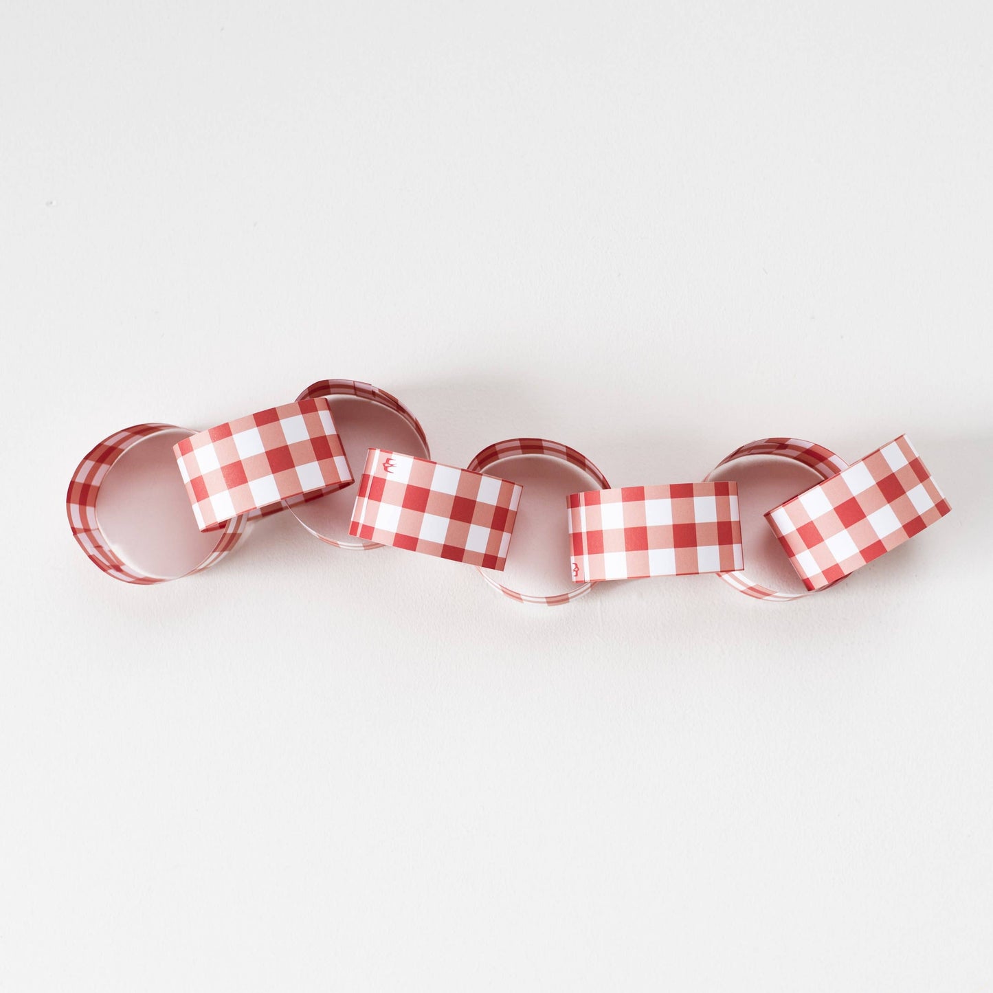 Festive gingham reusable paper chain kit with 48 pre-cut strips in assorted colours, no glue or tape needed, packaged in recyclable UK-made envelope