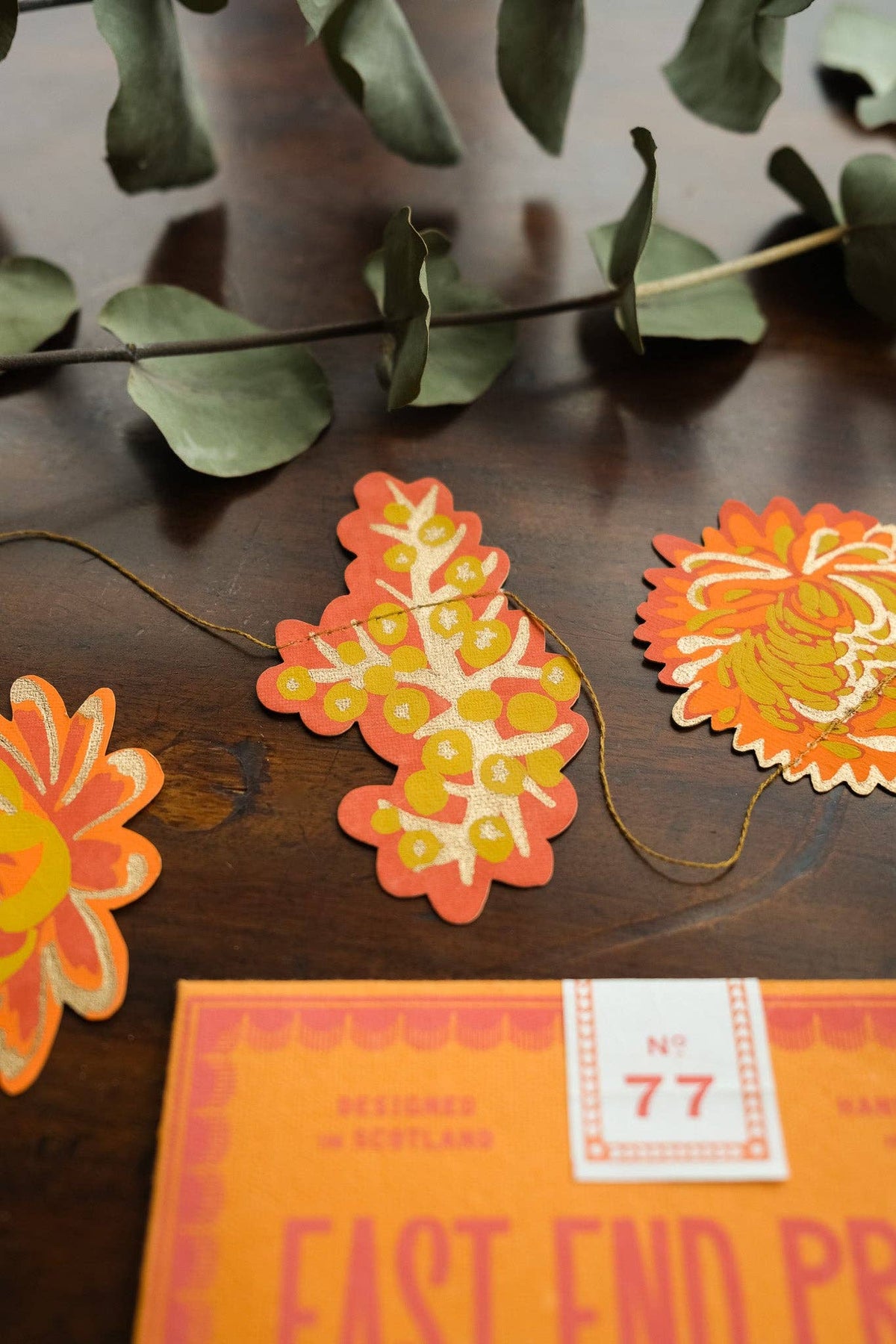 Detail of hand screen-printed autumn paper flowers
