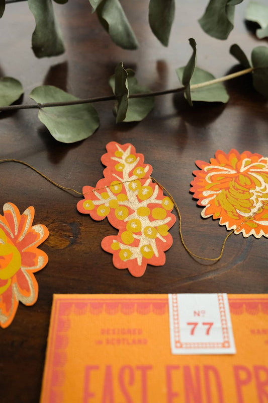 Detail of hand screen-printed autumn paper flowers