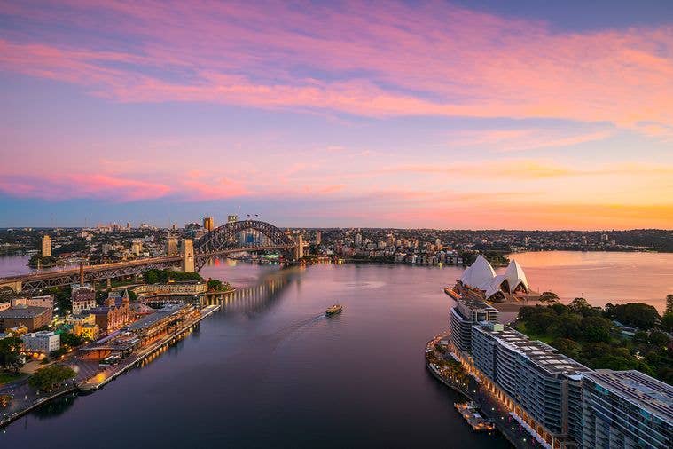 A beautiful pink and purple sunrise over Sydney Harbour. 