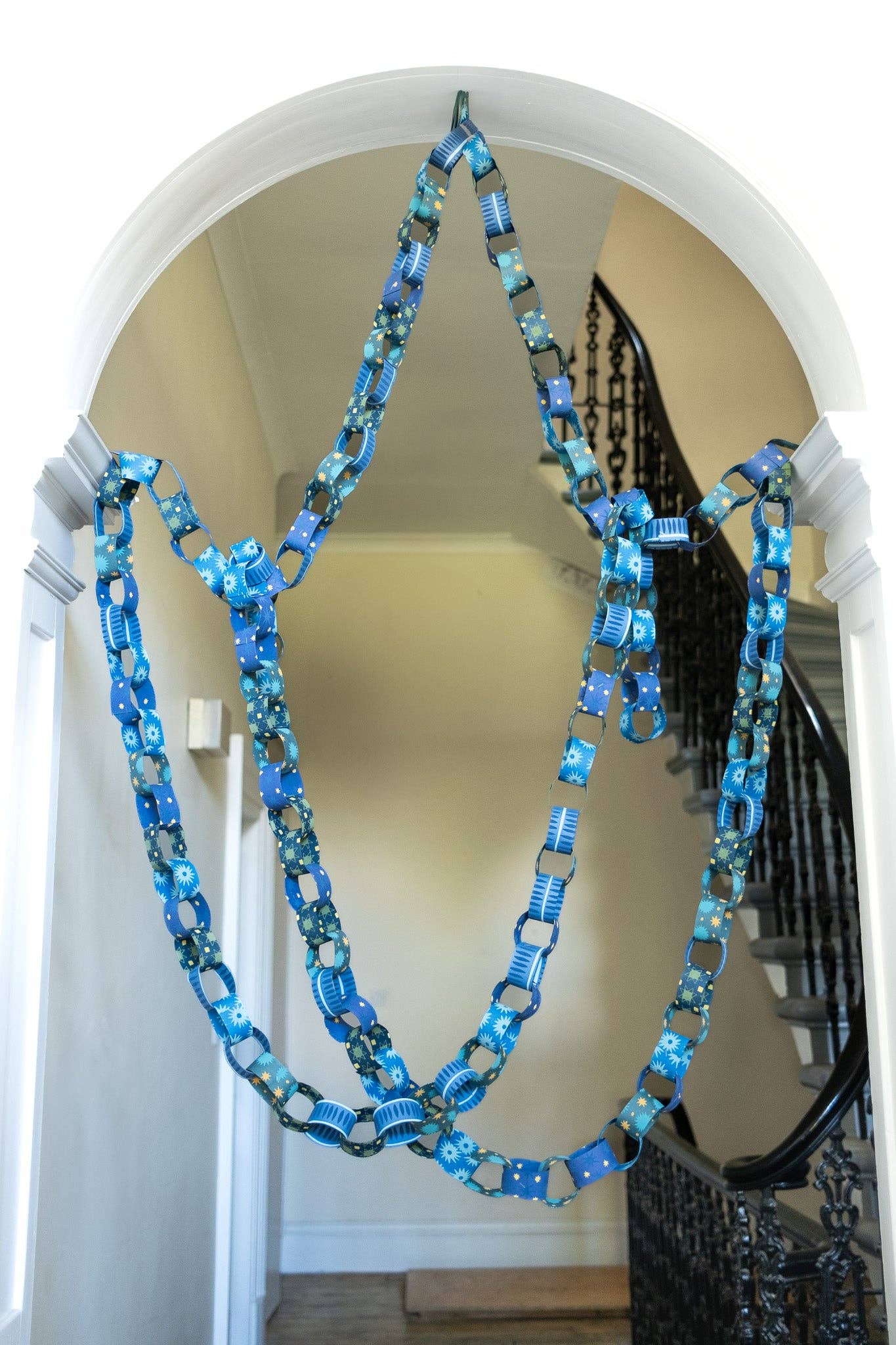 Beautifully draped blue and yellow recycled paper chain decoration