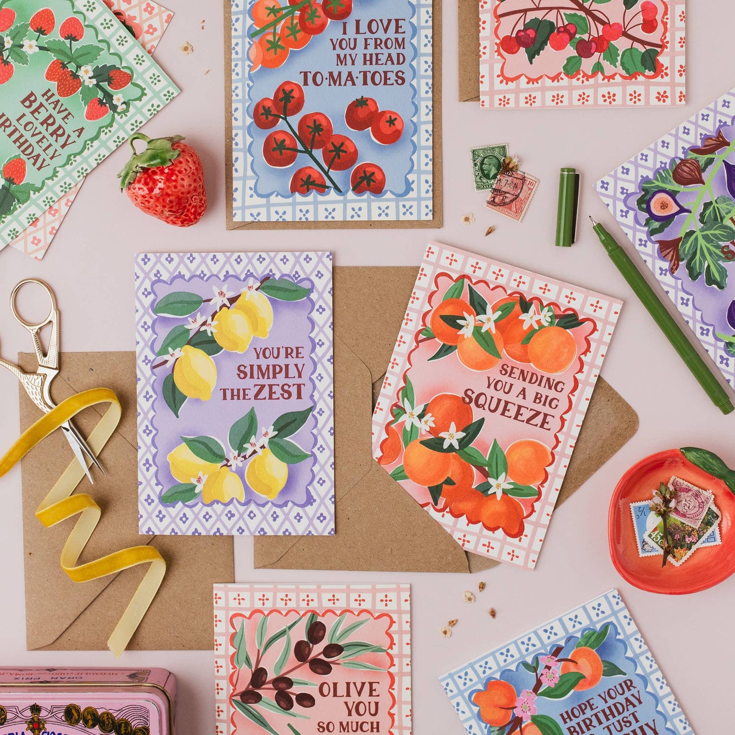 Flat lay of 'Big Squeeze' orange greeting card with a single kraft envelope