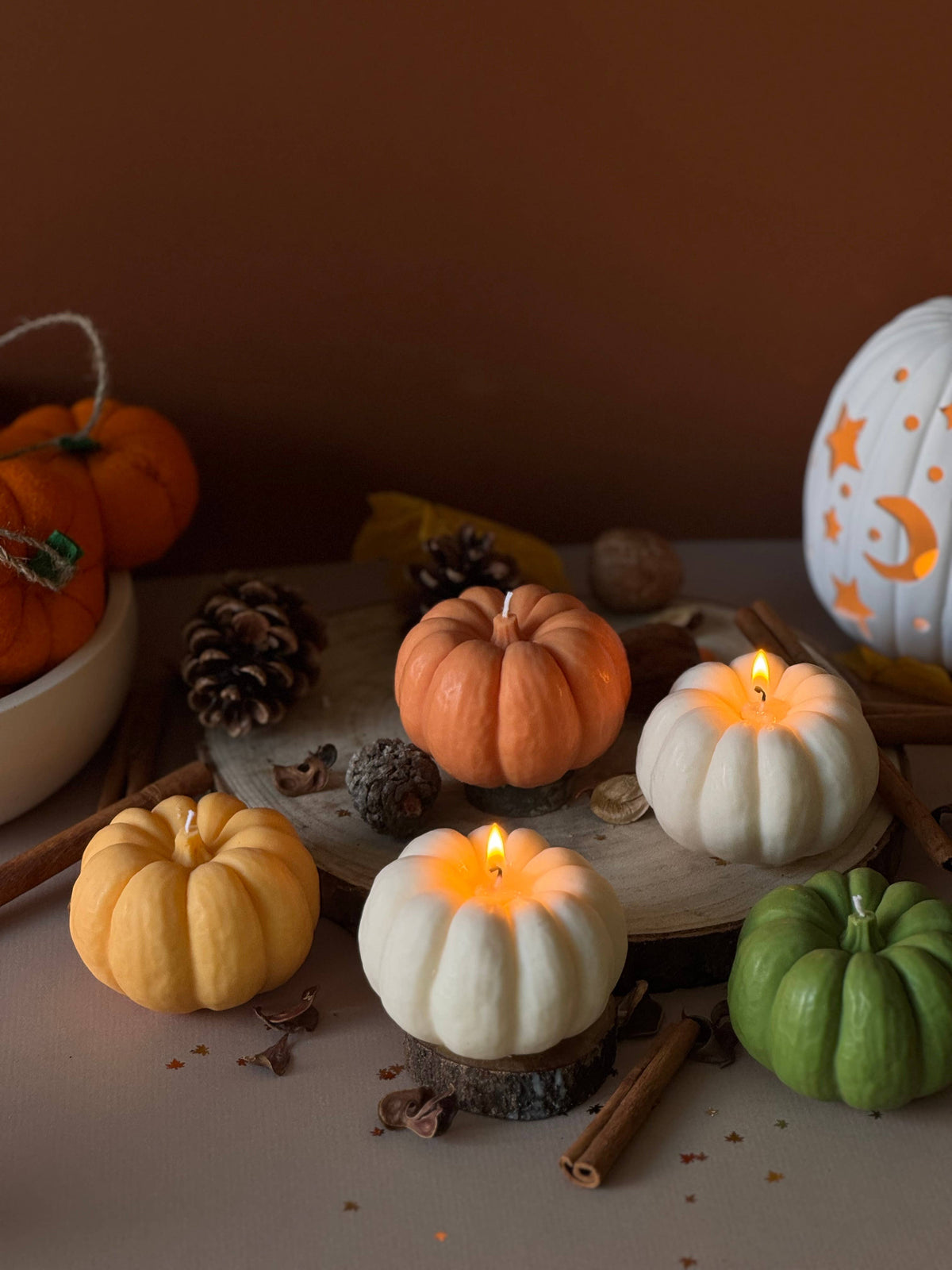 Cosy autumn home decor with pumpkin scented candle