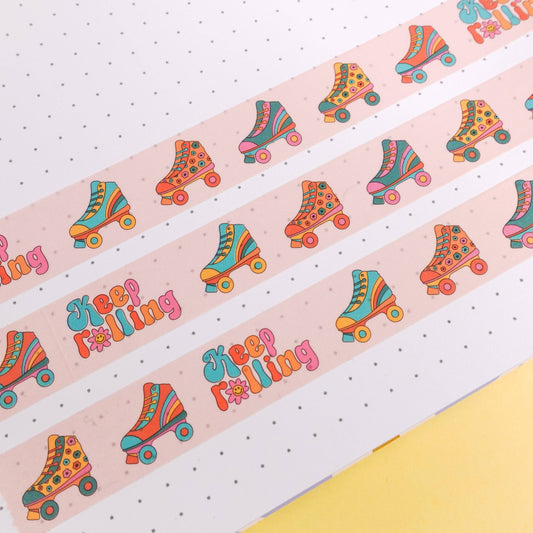 Funky washi tape with roller skate design and “Keep Rolling” message, 15mm x 10m roll, wrapped in eco-friendly paper—perfect for creative stationery and craft projects.