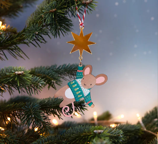 Close-up of a charming green Christmas mouse decoration, featuring a gold star and sustainable maple wood craft.