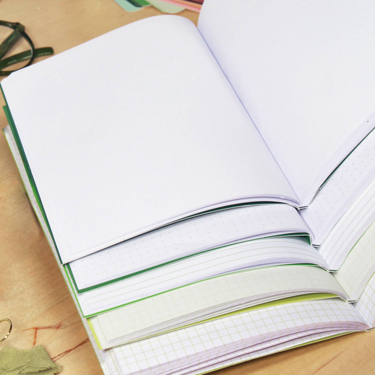 Gradient A5 notebooks shown alongside matching sketching pencils