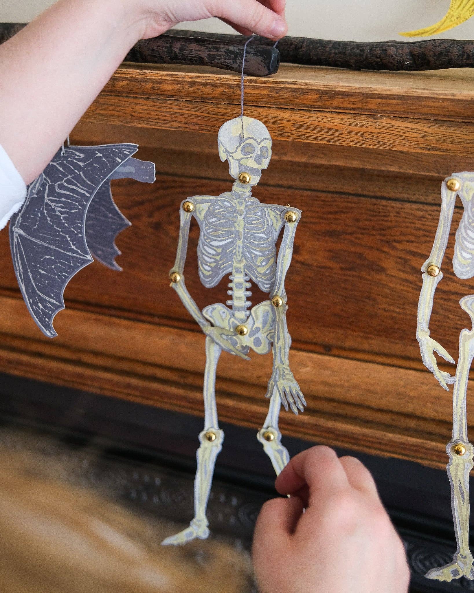 Set of two dancing skeletons paper ornaments, handmade from recycled materials.
