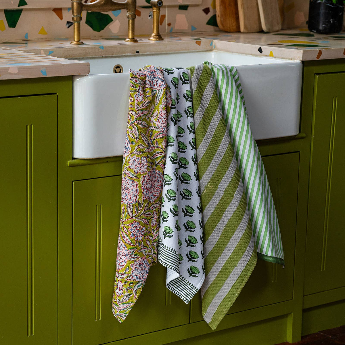 Sustainable green stripe tea towel with handy loop hook