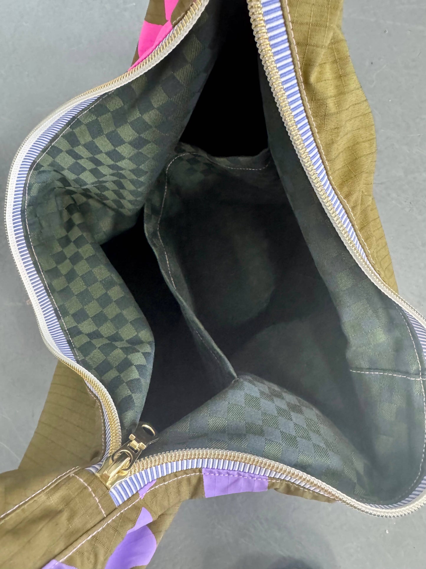 Yolla Studio Leopard Print Bag holding a laptop, demonstrating spaciousness.