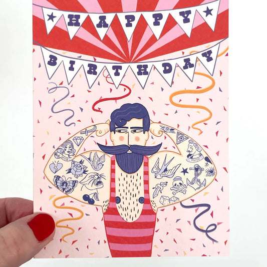 Close-up of Circus Strongman Birthday Card, showing Perlino Cotton texture and Su Owen's illustration detail.