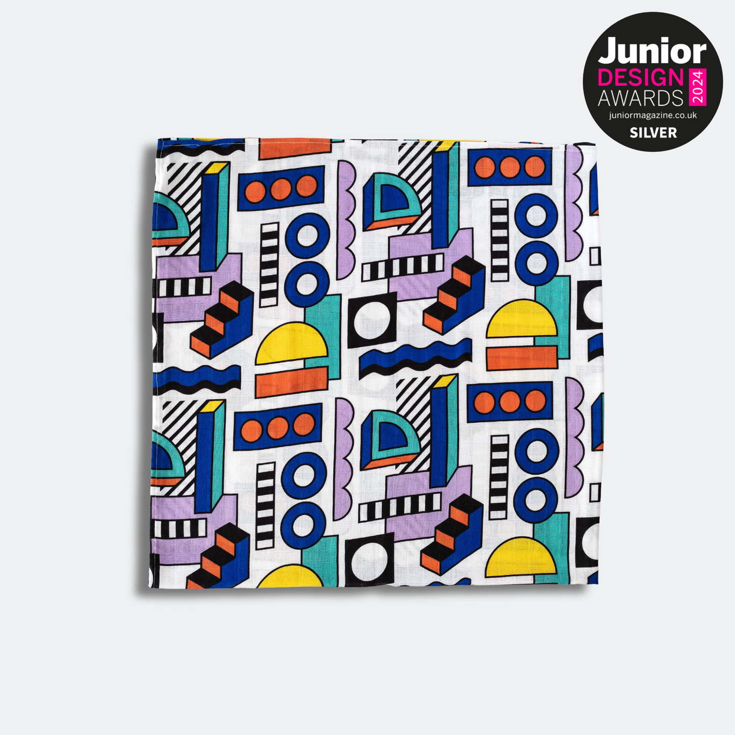 Etta Loves Walala 'Shapes' organic muslin draped, highlighting colourful, engaging design details