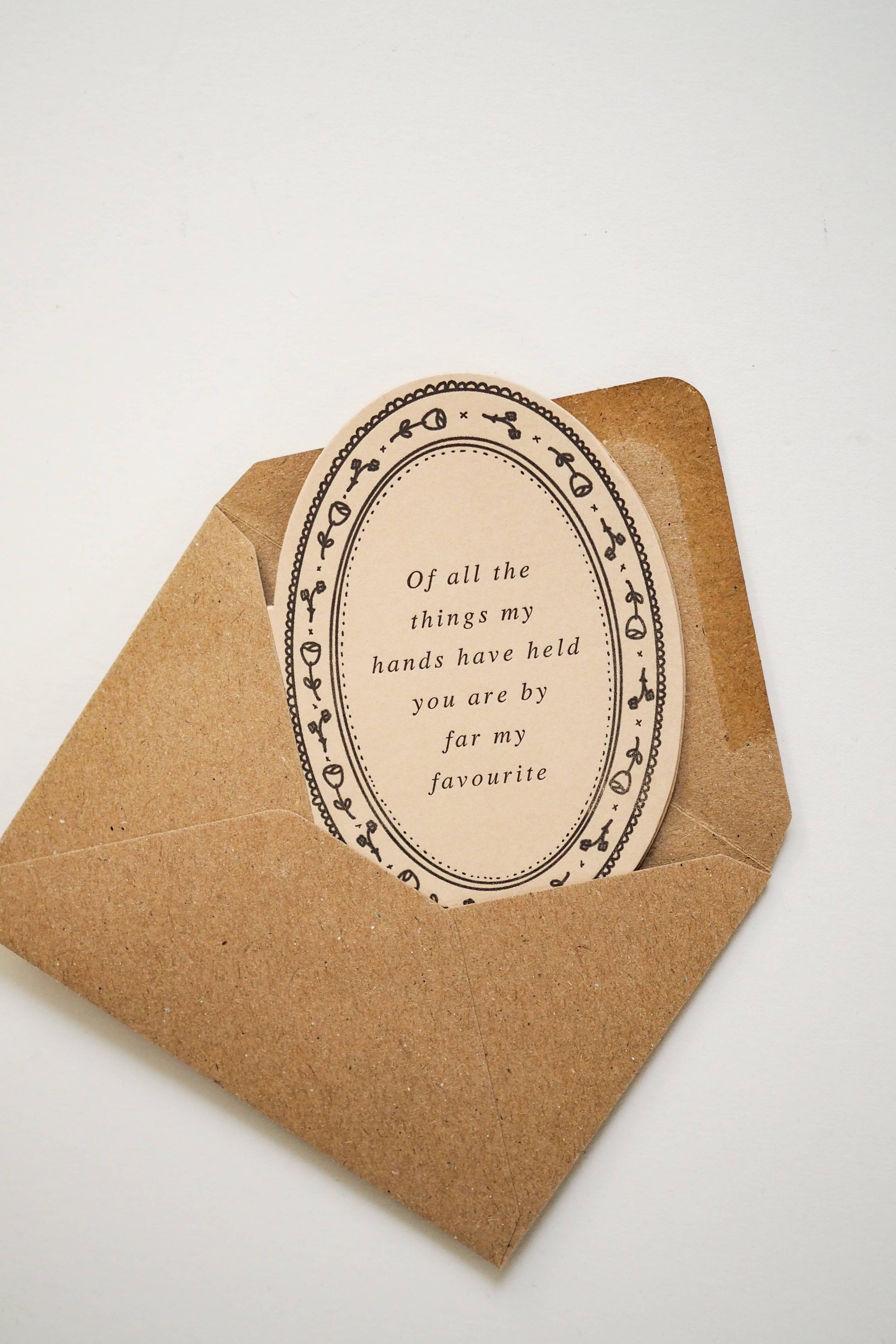 Die cut mini card by Soch & Co., featuring poem “Of all the things my hands have held you are by far my favourite”, letterpress, original illustration, envelope.