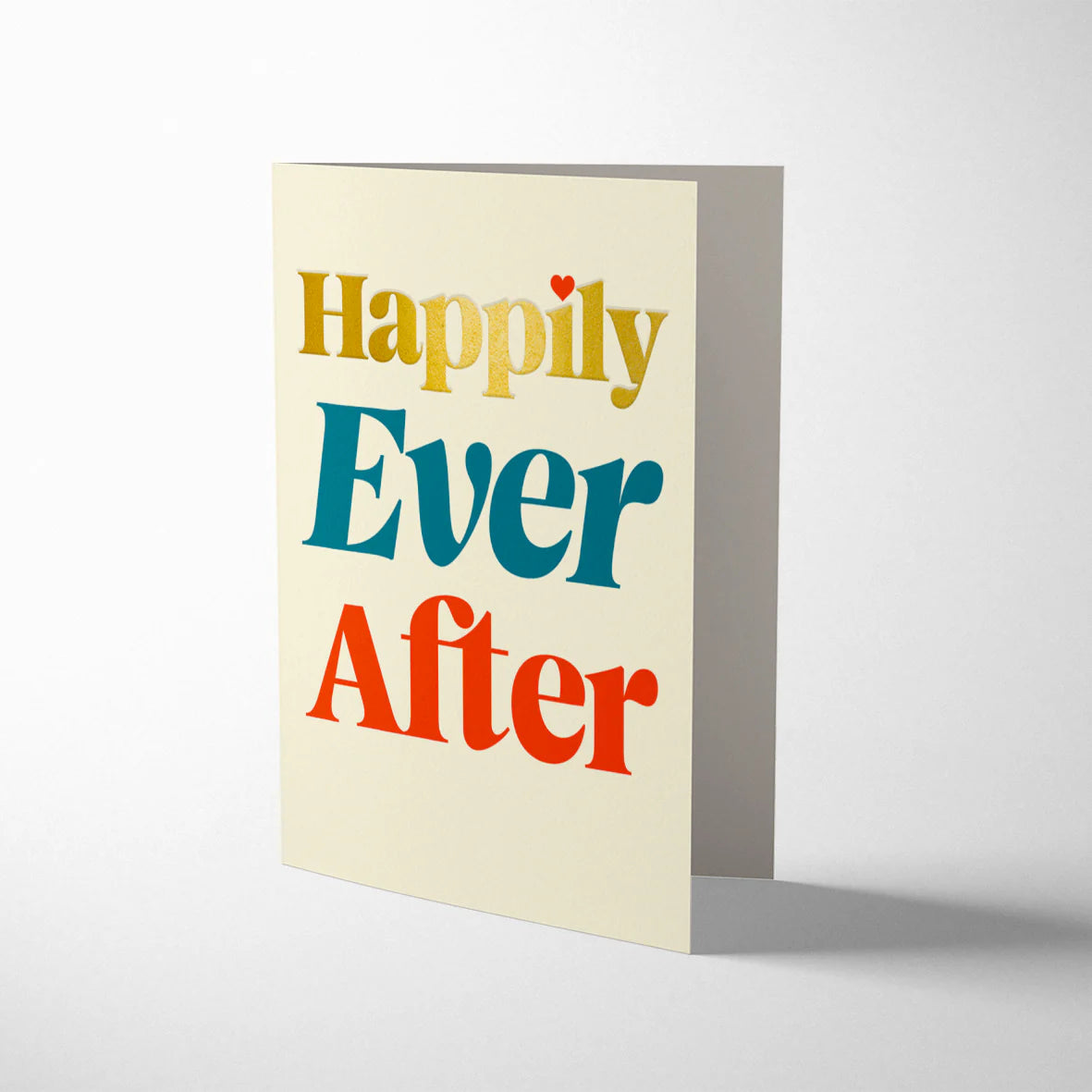 Eco-friendly wedding card with gold foil, “Happily Ever After” text, kraft envelope
