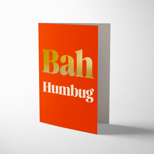 Serif Bah Humbug Christmas card by 1973, bold typography design with gold foiling detail, gold envelope, litho printed on sustainably certified paper, 108mm x 140mm.