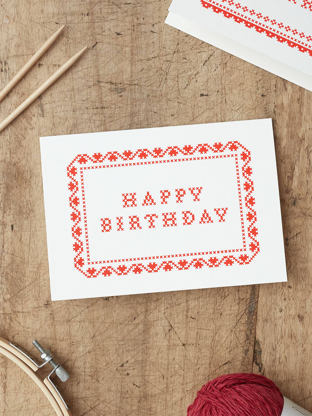 Hand-screenprinted Cross Stitch Happy Birthday Greeting Card in red ink