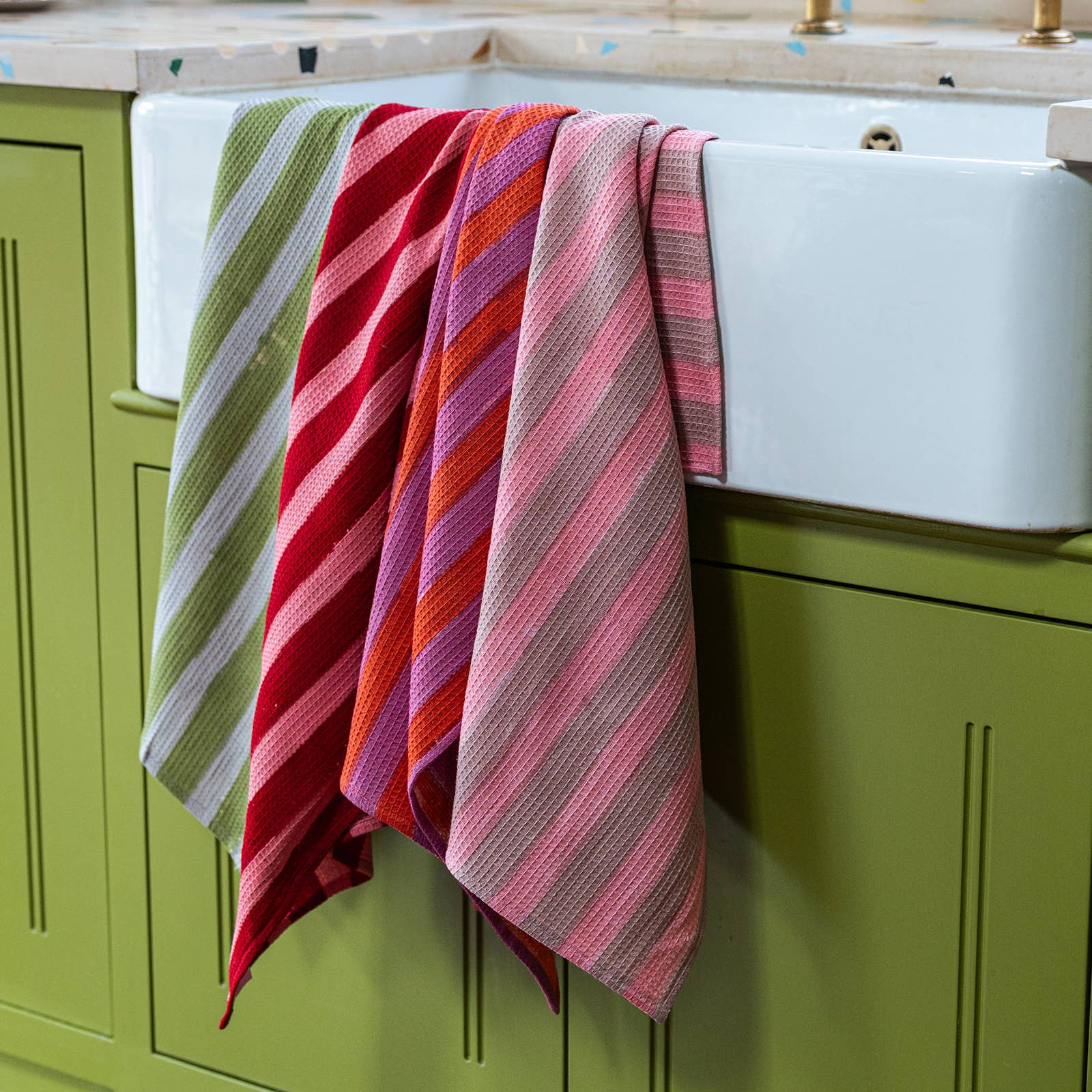 Waffle cotton tea towel in terracotta stripe with hanging loop